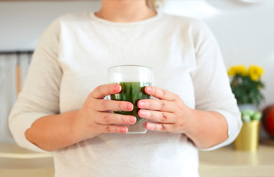 Female hands holding cup of sea moss 