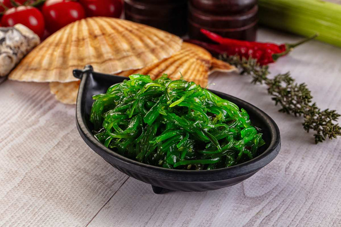 Seaweed in a black bowl with other ingredients
