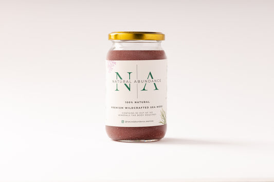 Jar of Natural Abundance 100% natural premium wildcrafted sea moss with gold lid on a white background.